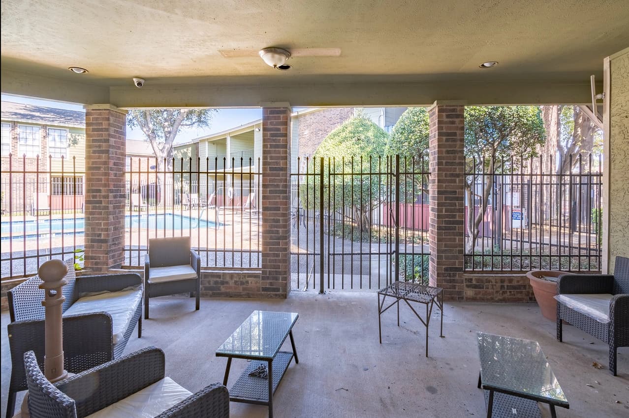 Enclosed sunroom and patio lounge at La Prada Place Apartment Homes