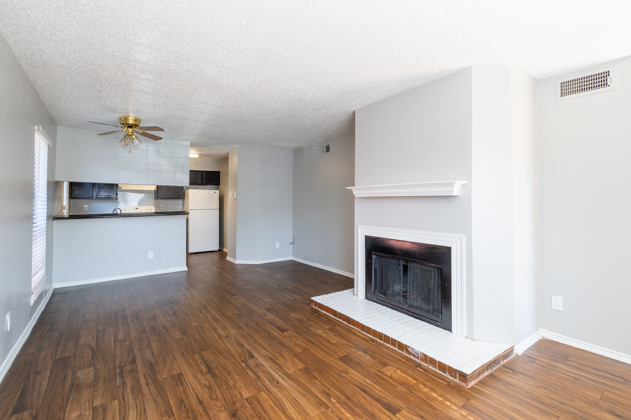 Upscale apartment kitchen with granite countertops and stainless steel appliances at our Dallas apartments for rent 
