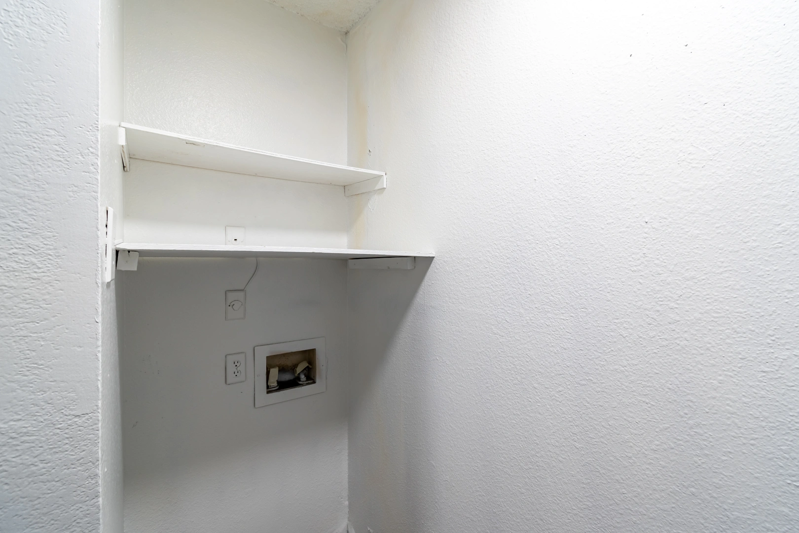 Full-size washer and dryer hookups at La Prada Place Apartment Homes