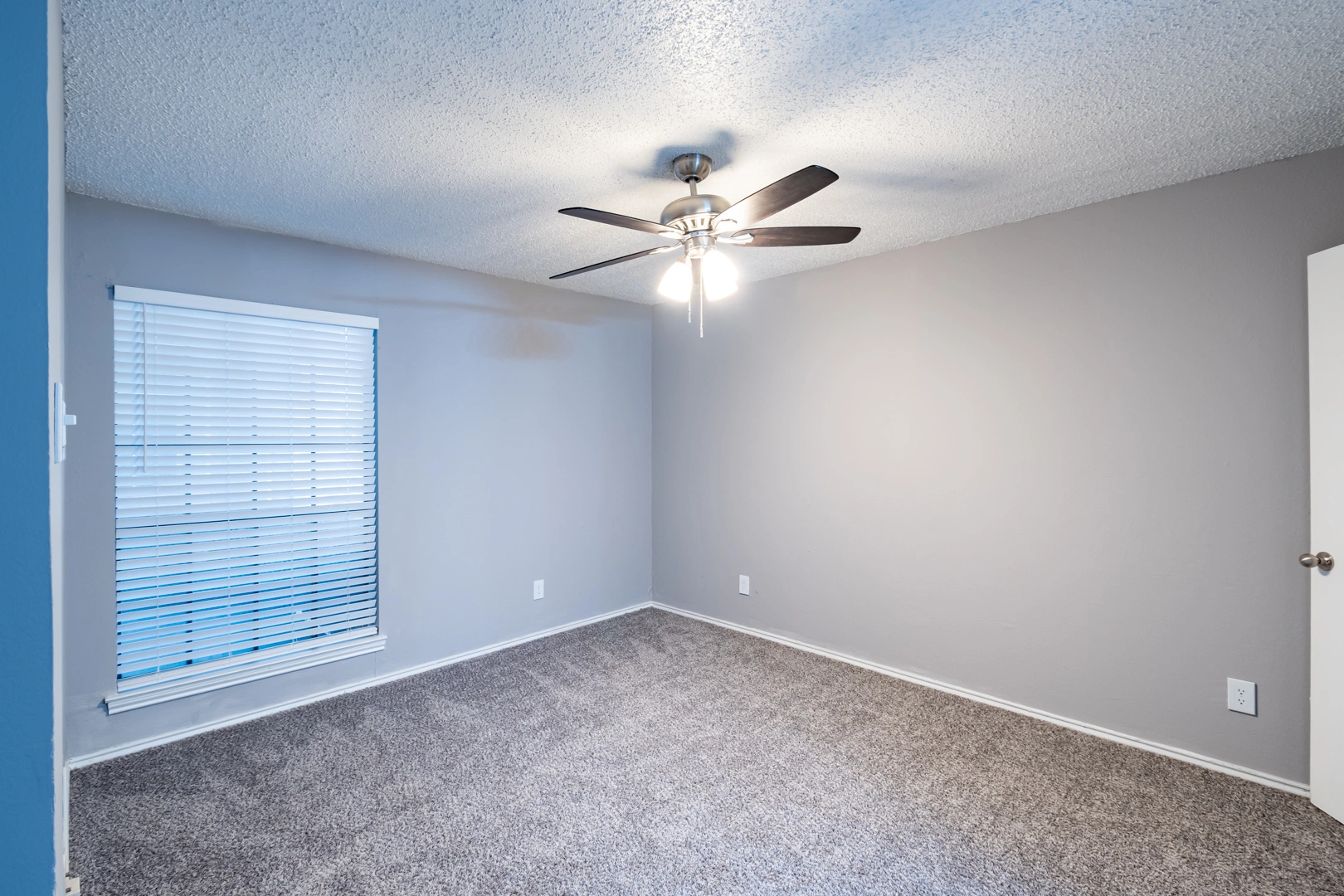 Bedroom window and ceiling fan at La Prada Place Apartment Homes