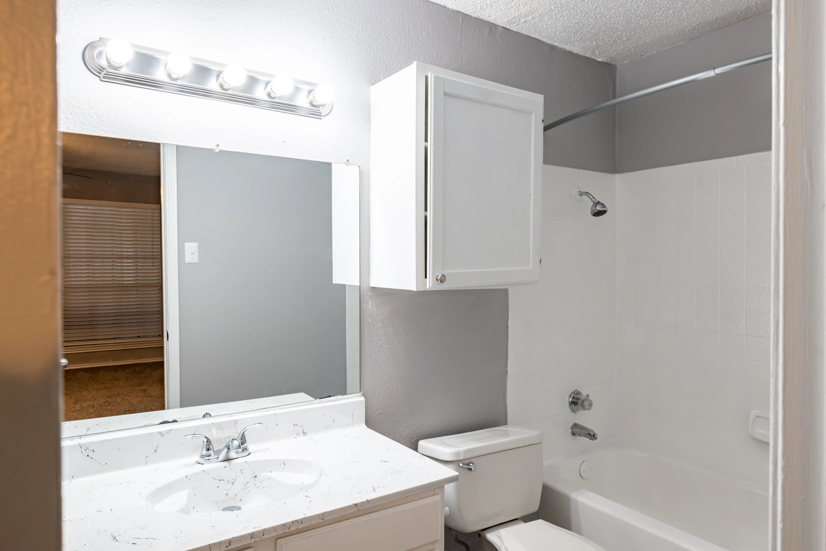 Contemporary white vanity at La Prada Place Apartment Homes