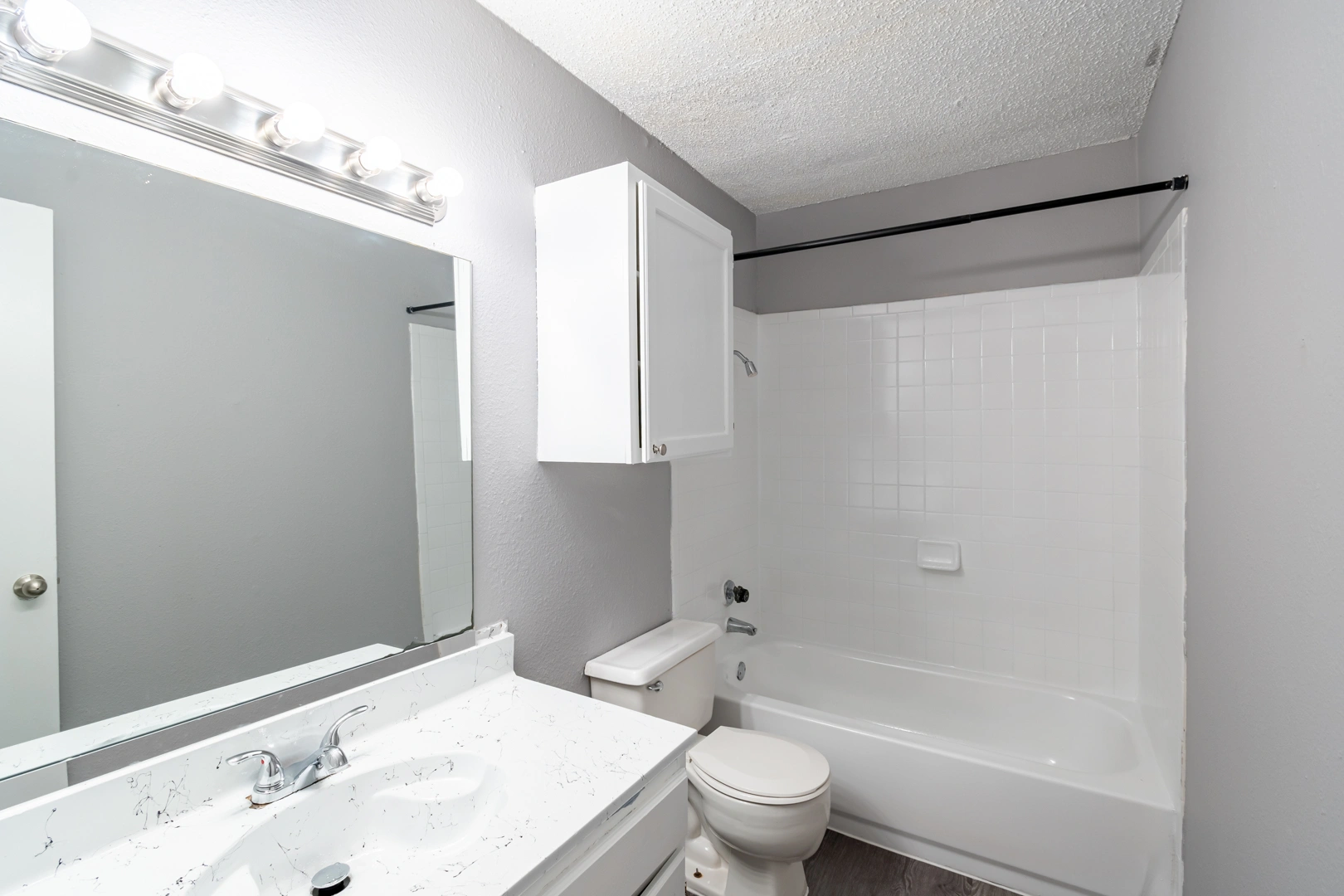 Full bathroom and tub surround at La Prada Place Apartment Homes