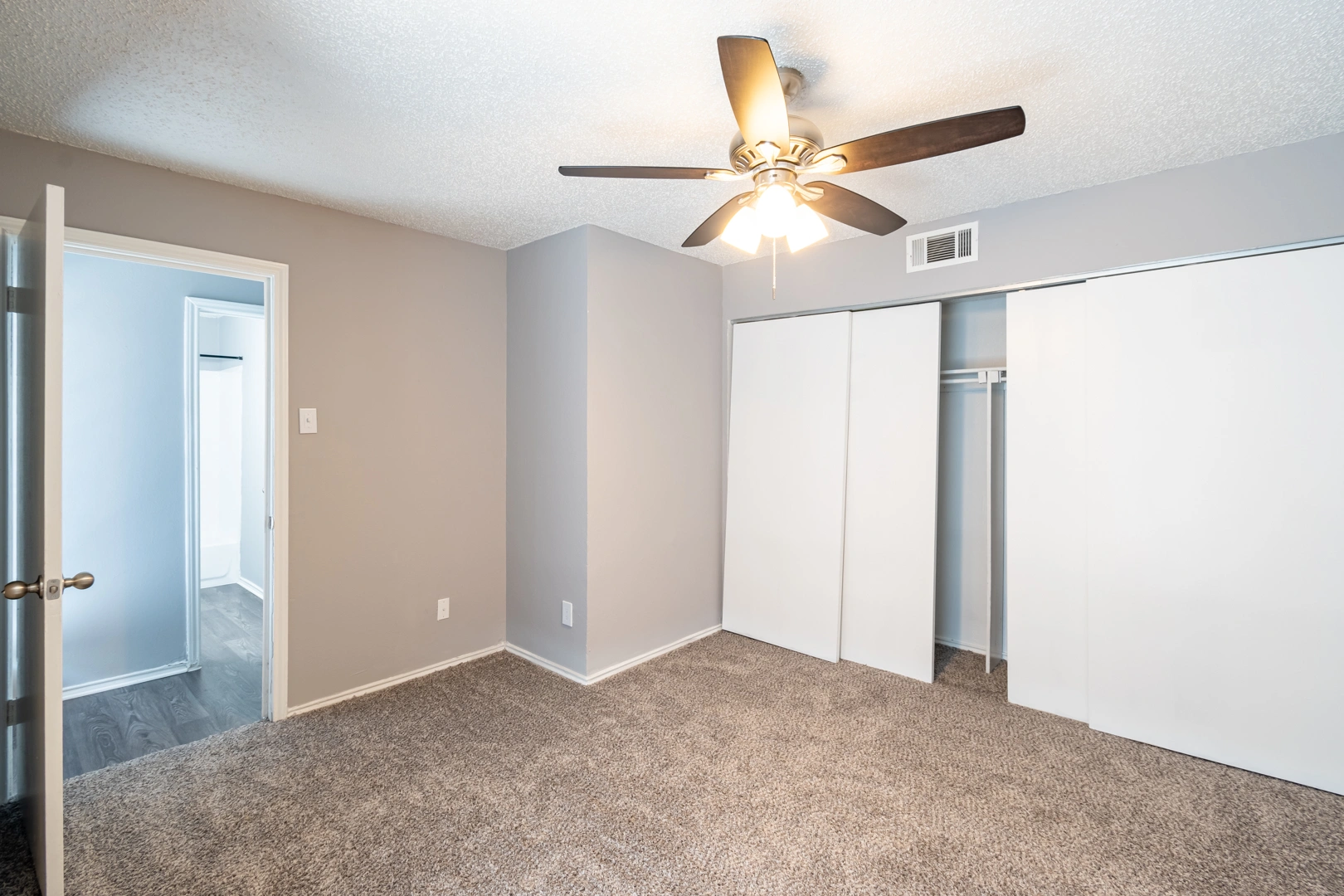 Bedroom layout and sliding doors at La Prada Place Apartment Homes