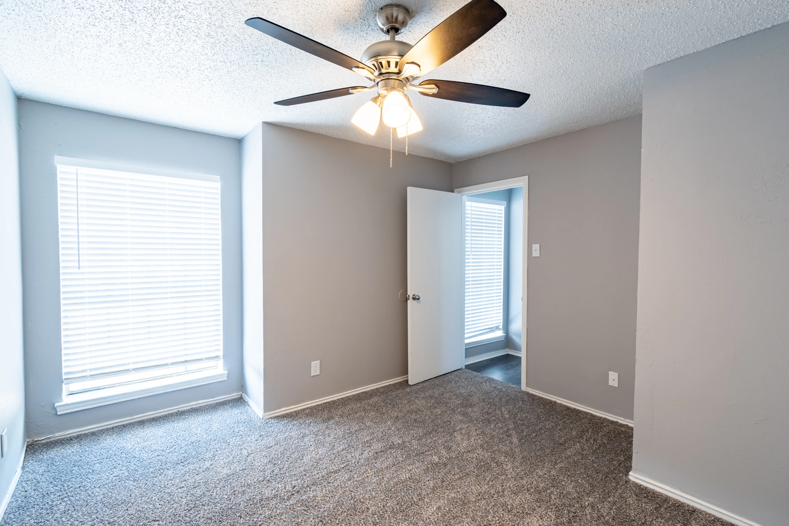 Bright corner bedroom at La Prada Place Apartment Homes