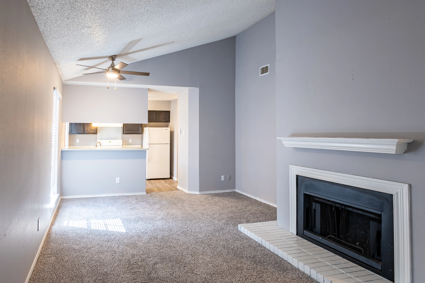 Living room and breakfast bar nook at La Prada Place Apartment Homes