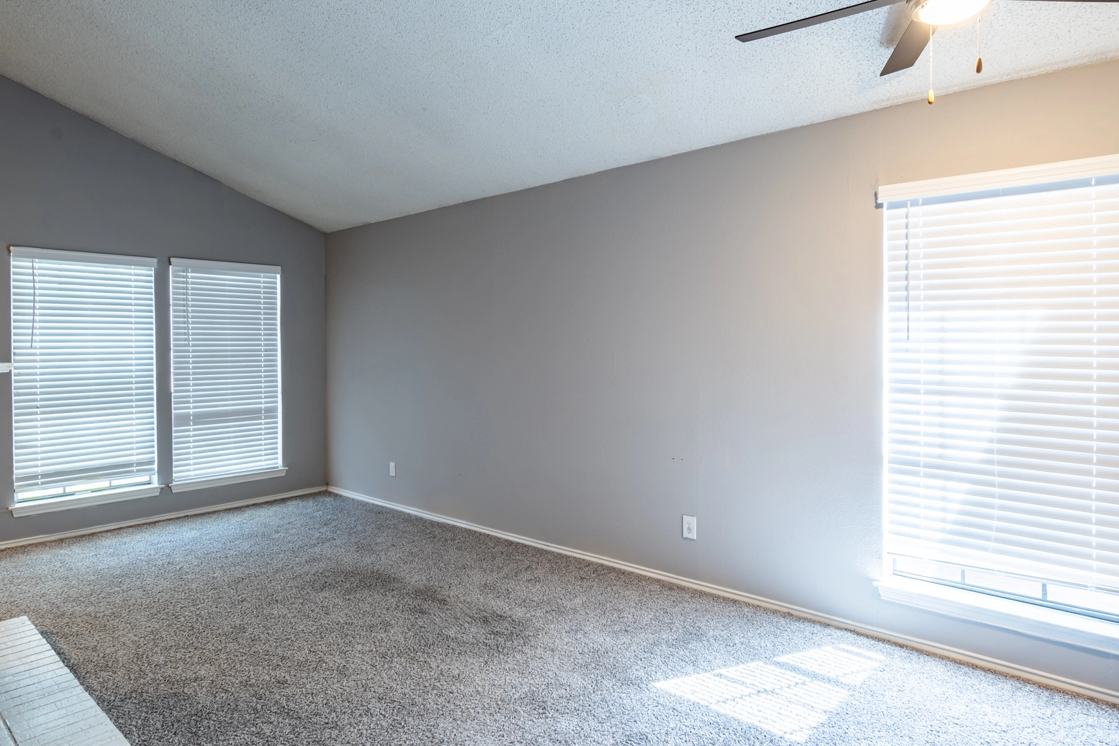 Sunlit open living room at La Prada Place Apartment Homes