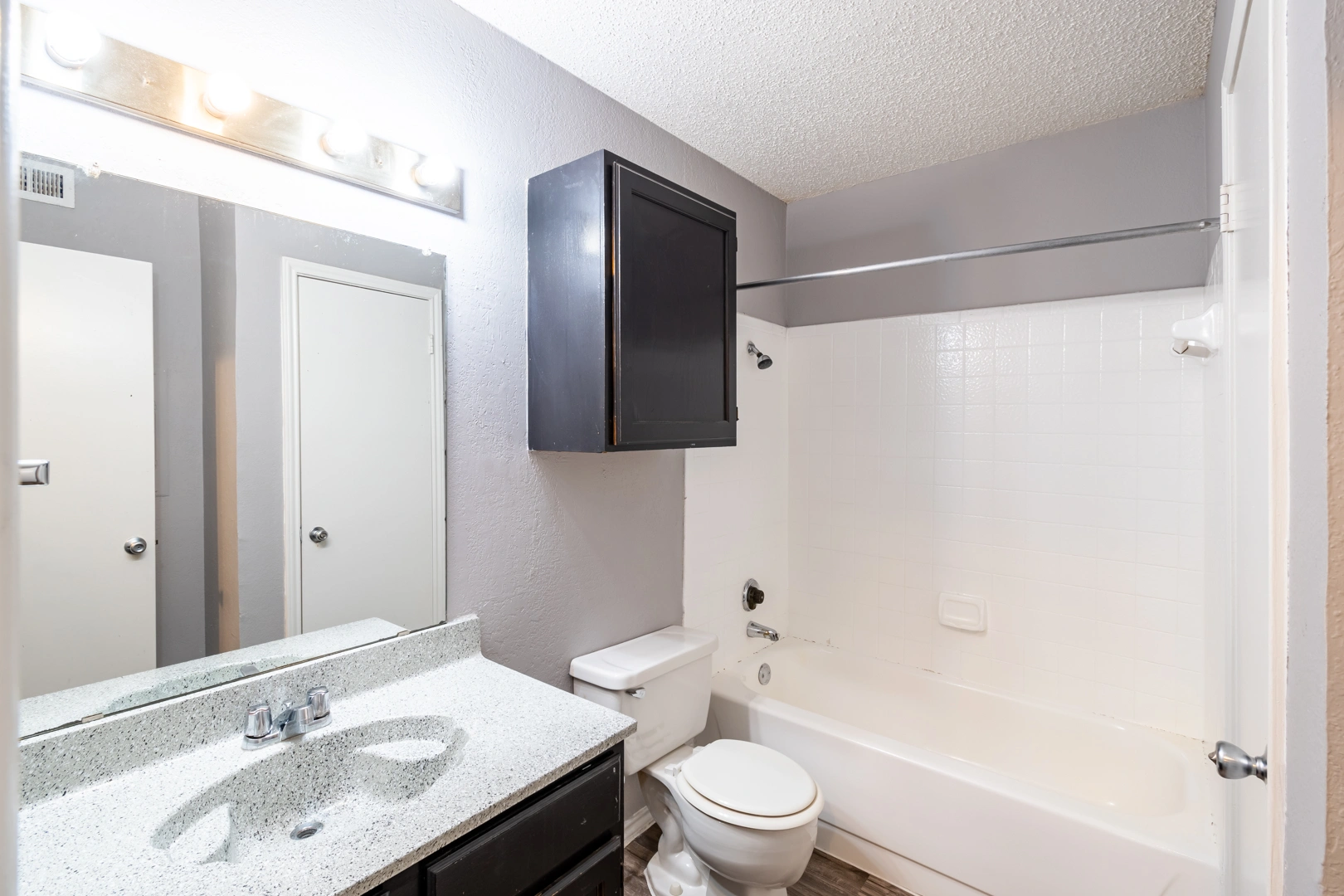 Full bathroom vanity and mirror at La Prada Place Apartment Homes