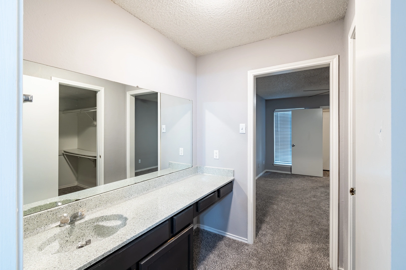 Large double-sink bath vanity at La Prada Place Apartment Homes
