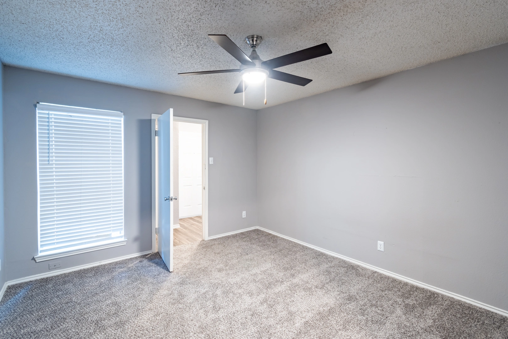 Primary bedroom with en-suite entry at La Prada Place Apartment Homes