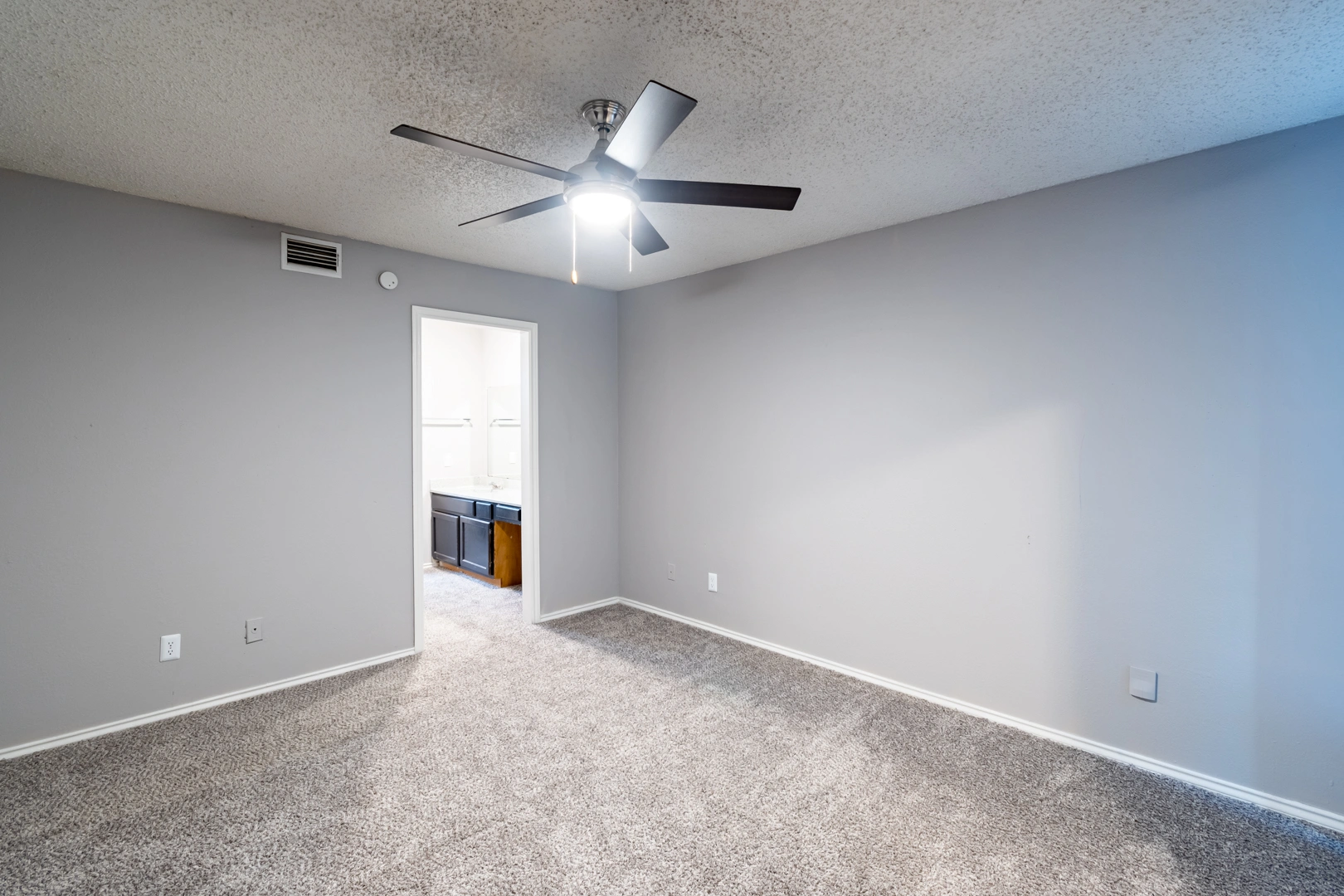 Bedroom ceiling fan and closet at La Prada Place Apartment Homes
