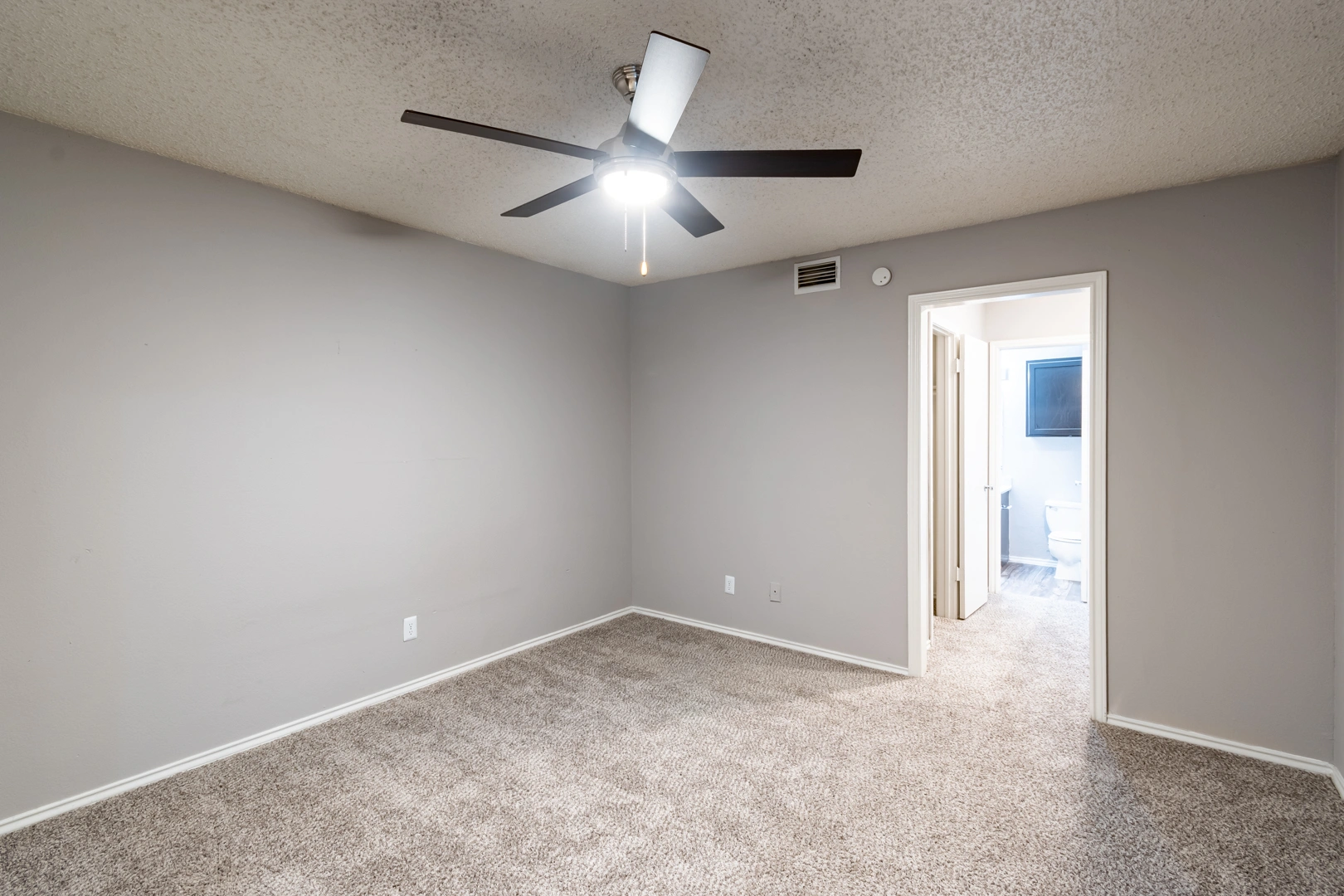 Sunlit bedroom at La Prada Place Apartment Homes