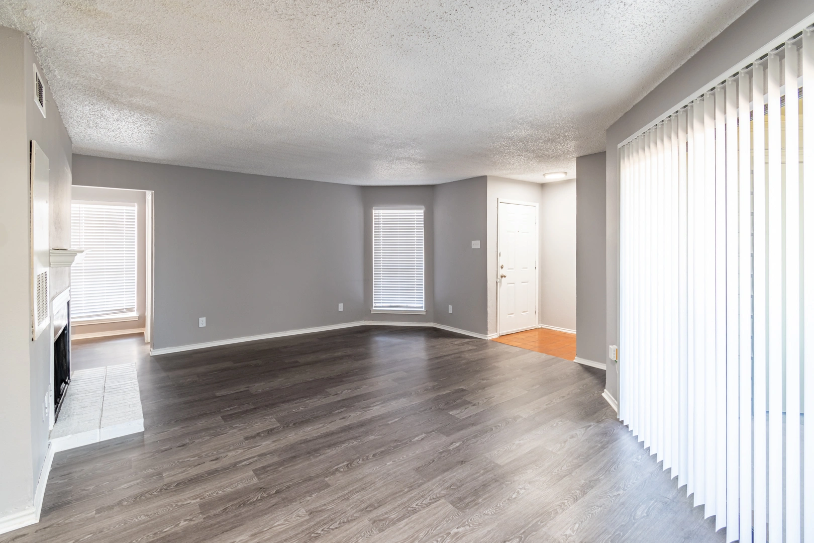 Living room French door access at La Prada Place Apartment Homes