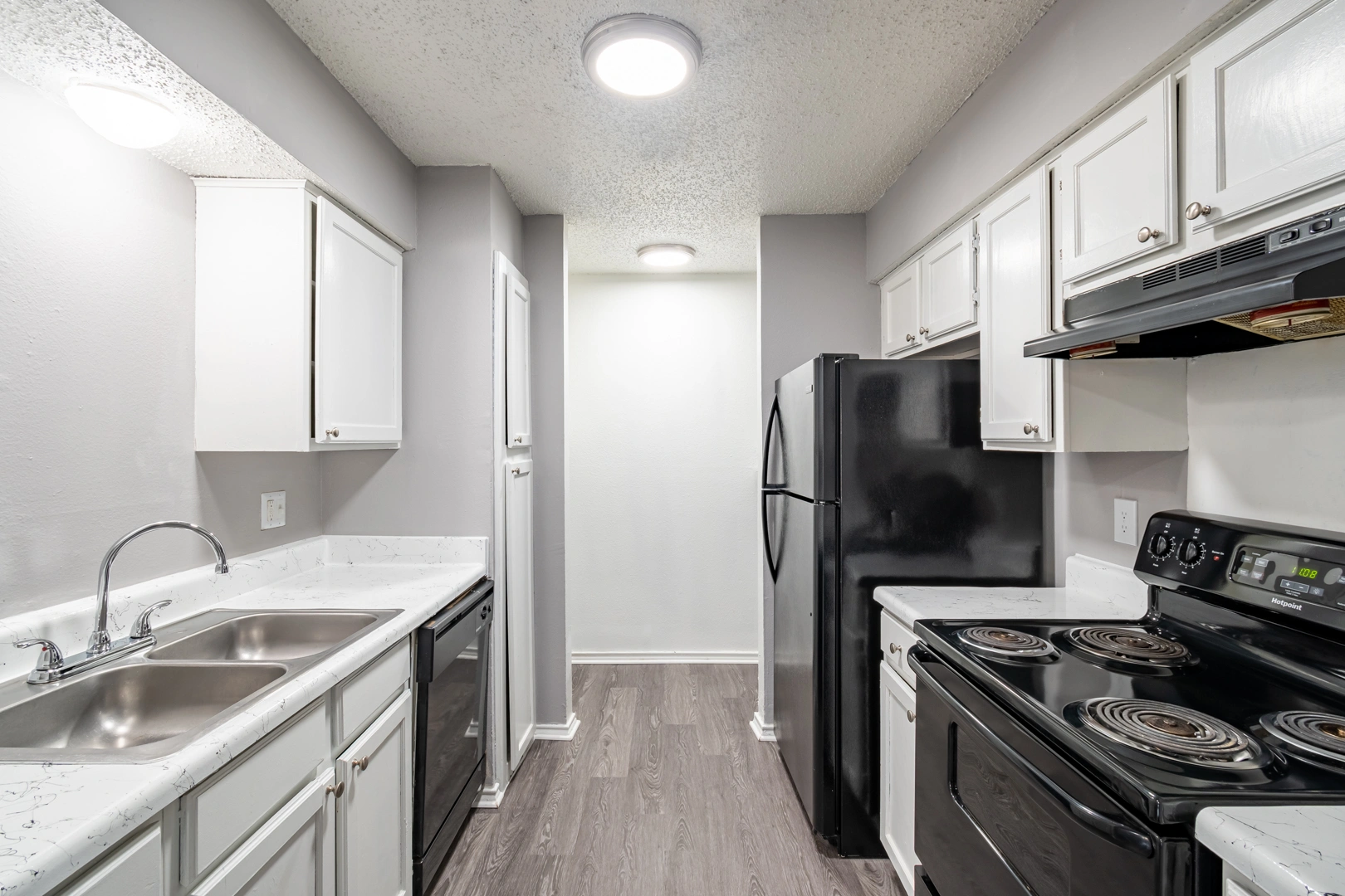 Bright galley kitchen at La Prada Place Apartment Homes