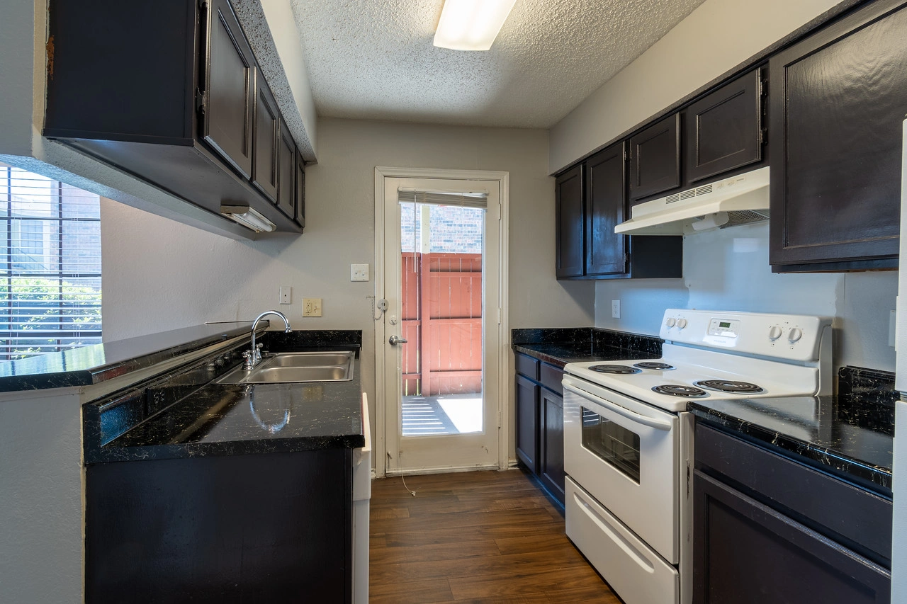 Kitchen with direct patio access at La Prada Place Apartment Homes