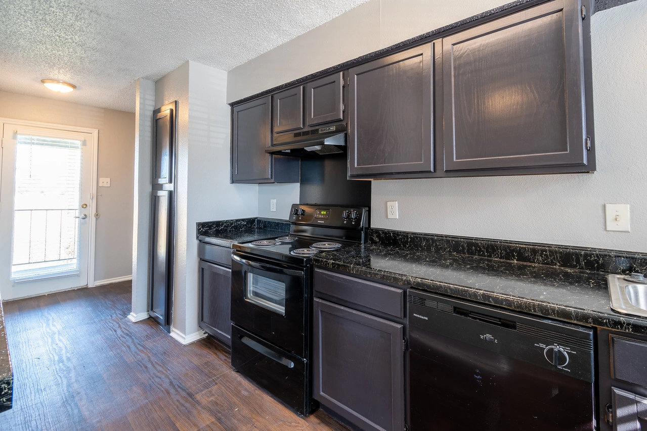 Upgraded kitchen with black appliances at La Prada Place Apartment Homes