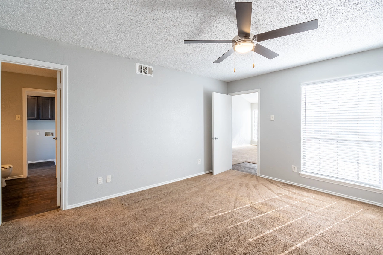 Bedroom and sliding closet at La Prada Place Apartment Homes