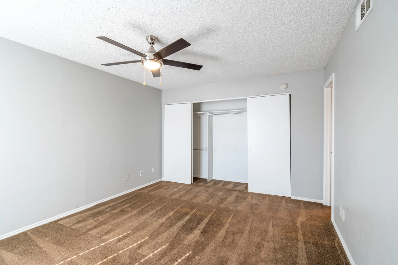 Second bedroom with ceiling fan at La Prada Place Apartment Homes